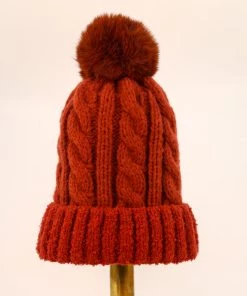 Powder Cosy Bobble Hat In Rust Loungewear And Accessories
