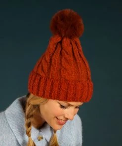 Powder Cosy Bobble Hat In Rust Loungewear And Accessories